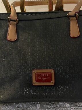GUESS Black Tote with Tan Handles and Red Plaque